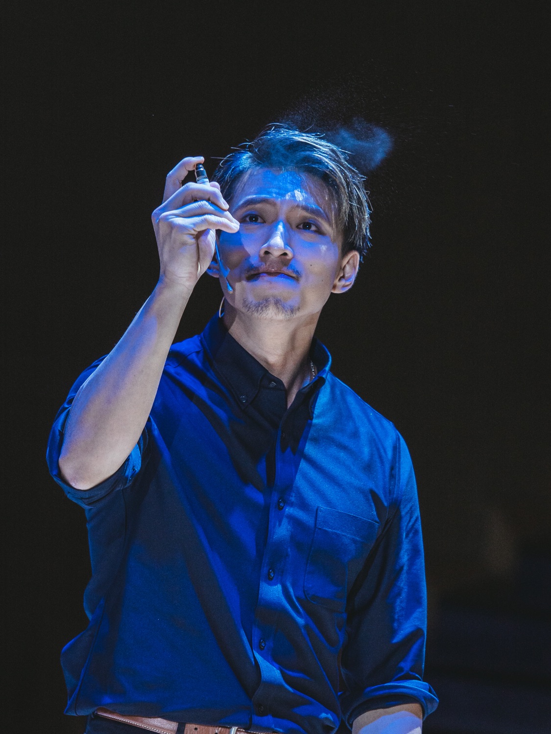 Terrence Leung performing on stage